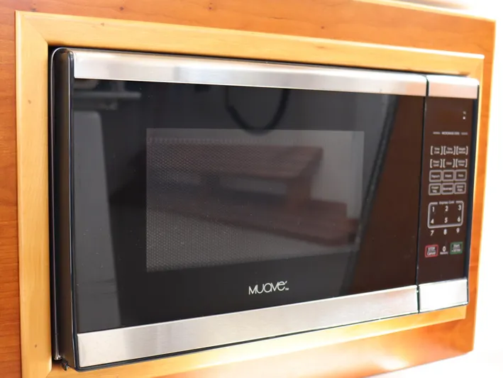 The Islander Yacht Photos Pics Built-in microwave in 2018 Cutwater C-302 Coupe boat kitchen.