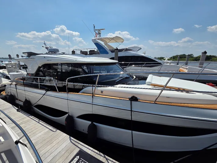  Yacht Photos Pics 2026 Marex 440 yacht docked at marina under clear blue sky.