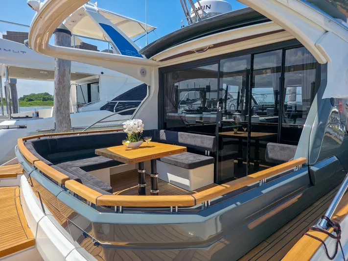  Yacht Photos Pics Luxury Marex 440 yacht, 2026 model, featuring elegant outdoor seating and dining area.
