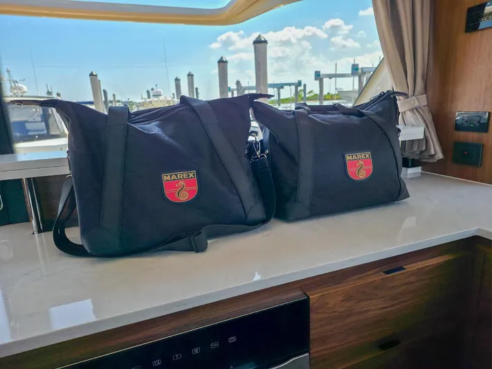  Yacht Photos Pics Marex 440 boat interior with branded bags on countertop, 2026 model.