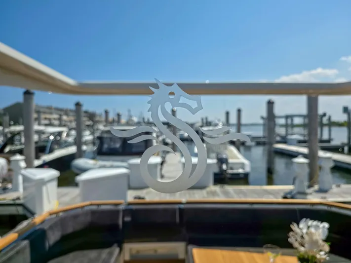  Yacht Photos Pics Marex 440 yacht interior with marina view, featuring a seahorse design on glass, 2026 model.