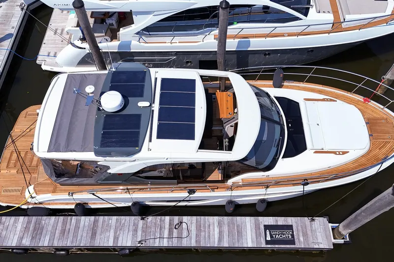  Yacht Photos Pics 2026 Marex 440 yacht docked, featuring solar panels and sleek design.