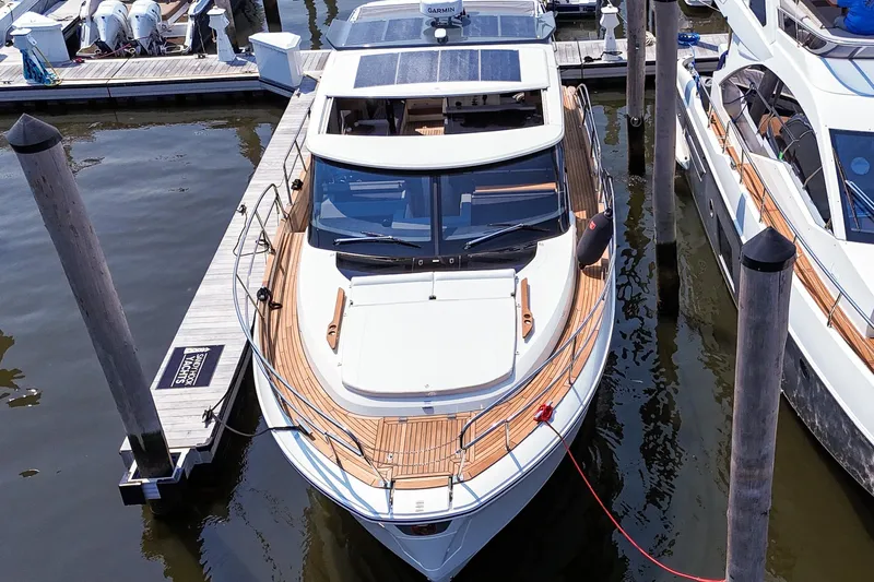  Yacht Photos Pics 2026 Marex 440 yacht docked at marina, showcasing sleek design and modern features.