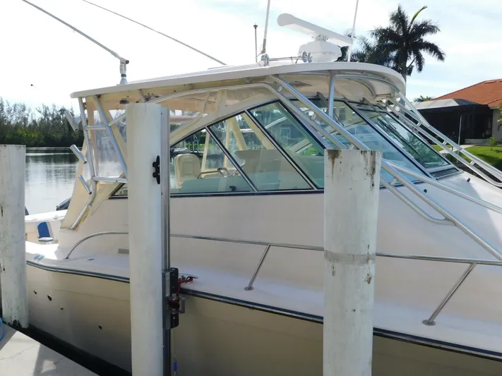  Yacht Photos Pics 2008 Grady-White Express 360 boat docked by a serene waterfront.