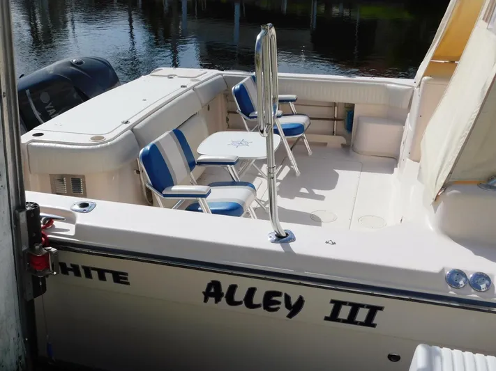  Yacht Photos Pics 2008 Grady-White Express 360 boat with seating and table on deck.