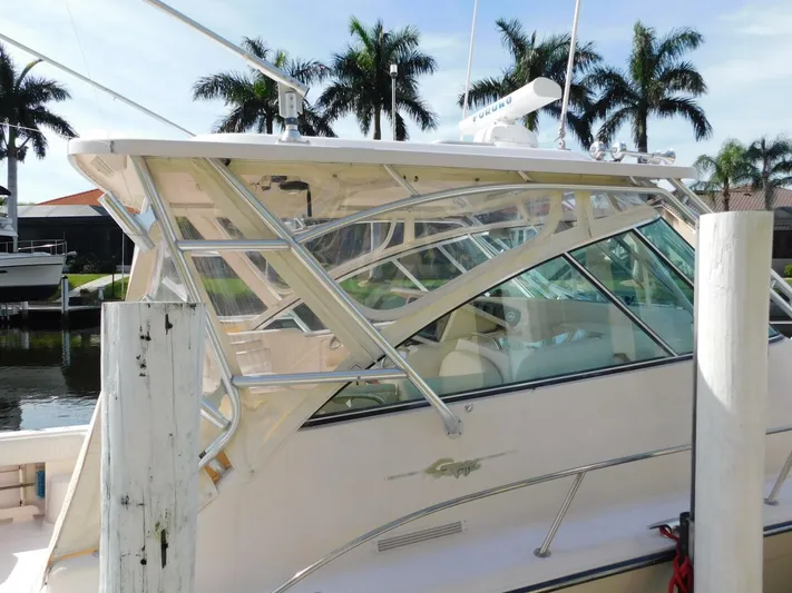  Yacht Photos Pics 2008 Grady-White Express 360 boat docked near palm trees.