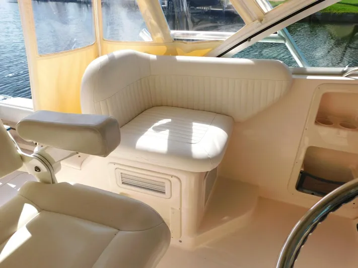  Yacht Photos Pics 2008 Grady-White Express 360 boat interior with cushioned seating and helm area.