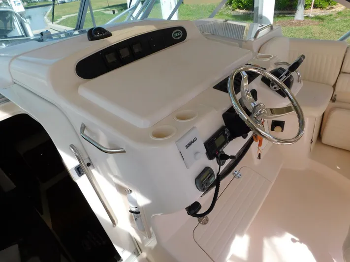  Yacht Photos Pics 2008 Grady-White Express 360 helm with steering wheel and controls.