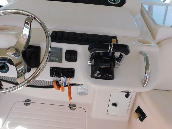  Yacht Photos Pics 2008 Grady-White Express 360 helm with steering wheel and controls.