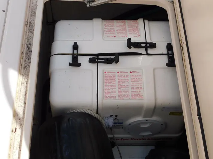  Yacht Photos Pics Storage compartment of 2008 Grady-White Express 360 boat with secured white container.