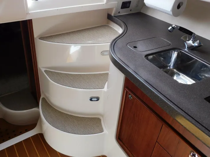  Yacht Photos Pics 2008 Grady-White Express 360 interior with steps and kitchenette area.