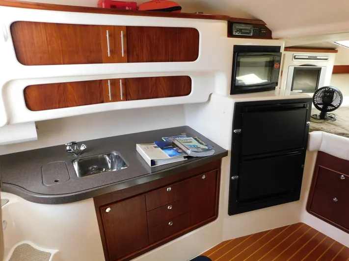  Yacht Photos Pics 2008 Grady-White Express 360 cabin interior with kitchenette, sink, and storage cabinets.