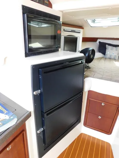  Yacht Photos Pics 2008 Grady-White Express 360 cabin with microwave, fridge, and cozy sleeping area.