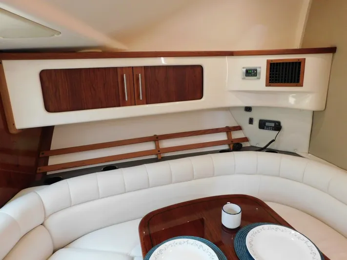  Yacht Photos Pics 2008 Grady-White Express 360 cabin interior with white seating and wooden accents.