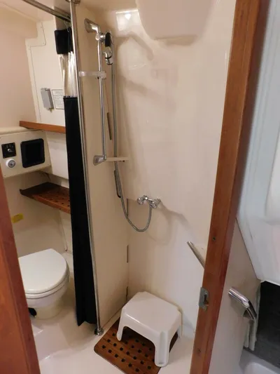  Yacht Photos Pics 2008 Grady-White Express 360 bathroom with shower, toilet, and wooden accents.