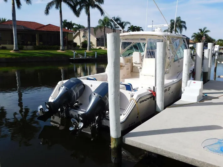  Yacht Photos Pics 2008 Grady-White Express 360 boat docked by palm trees.
