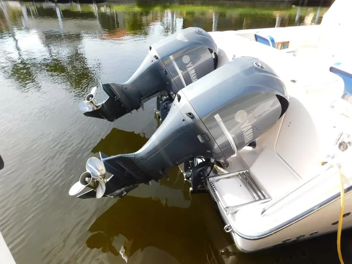  Yacht Photos Pics 2008 Grady-White Express 360 with dual outboard motors docked on calm water.