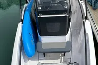 2022 Axopar 22 T-Top boat docked in marina, featuring sleek design and modern amenities.