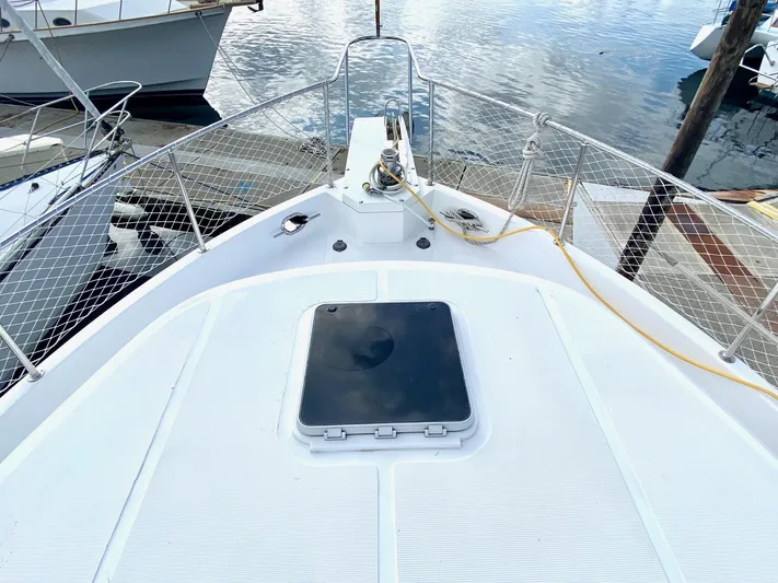 First Light Yacht Photos Pics Deck of 1999 Ocean Alexander 510 Pilothouse yacht in harbor.