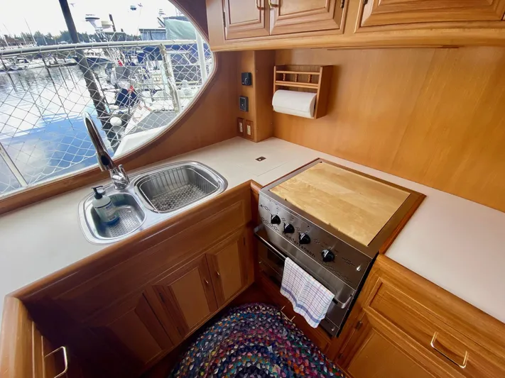 First Light Yacht Photos Pics Kitchen area of 1999 Ocean Alexander 510 Pilothouse.