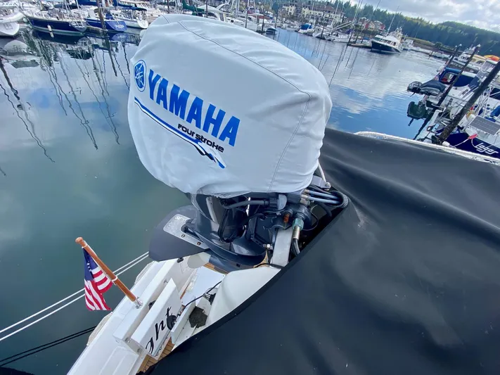 First Light Yacht Photos Pics Yamaha outboard motor on 1999 Ocean Alexander 510 Pilothouse in harbor.