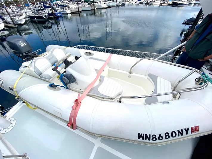 First Light Yacht Photos Pics Inflatable dinghy on Ocean Alexander 510 Pilothouse, 1999 model, docked at marina.