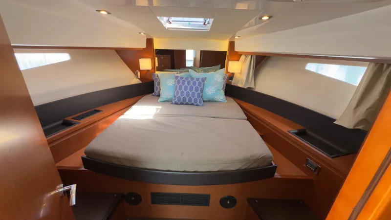  Yacht Photos Pics Cabin interior of 2016 Jeanneau Velasco 37F with cozy bed and modern design.