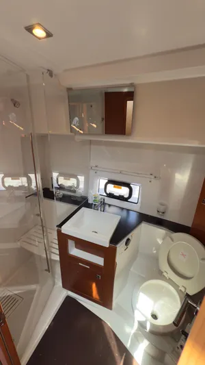  Yacht Photos Pics Bathroom interior of 2016 Jeanneau Velasco 37F yacht with modern fixtures.