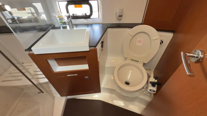  Yacht Photos Pics Bathroom interior of 2016 Jeanneau Velasco 37F yacht with sink and toilet.