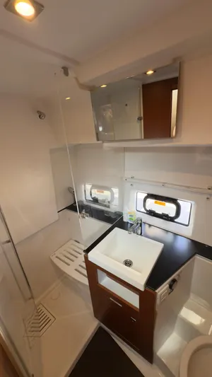  Yacht Photos Pics 2016 Jeanneau Velasco 37F bathroom with modern fixtures and compact design.