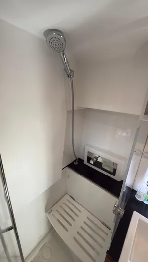  Yacht Photos Pics Shower area in 2016 Jeanneau Velasco 37F yacht, featuring modern fixtures and sleek design.