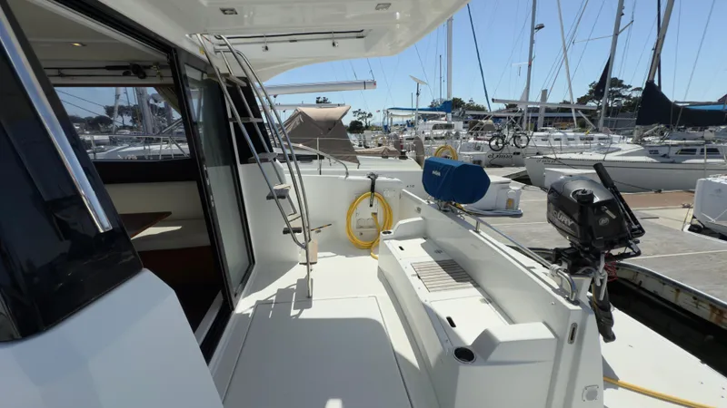  Yacht Photos Pics 2016 Jeanneau Velasco 37F yacht deck with marina view, featuring seating and ladder.