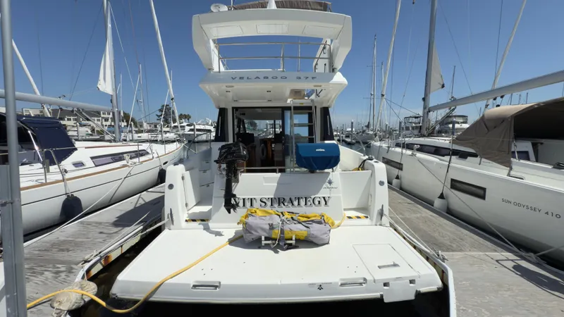  Yacht Photos Pics 2016 Jeanneau Velasco 37F yacht docked at marina, surrounded by sailboats.