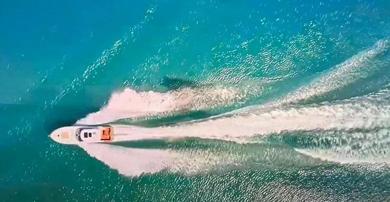 Jet Stream Yacht Photos Pics Aerial view of 2018 Spencer Yachts JET BOAT cruising on turquoise water.