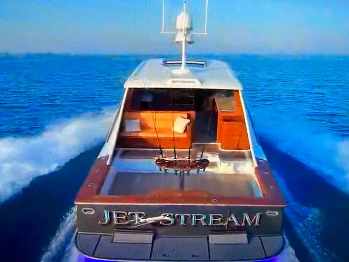 Jet Stream Yacht Photos Pics 2018 Spencer Yachts JET BOAT cruising on open water, rear view.