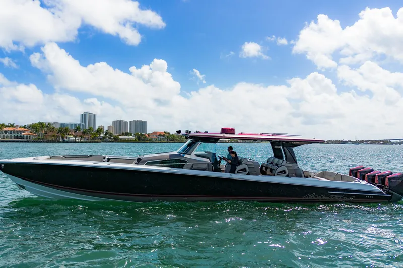  Yacht Photos Pics 2023 Nor-Tech 500 Sport Center Console boat cruising on a sunny day.