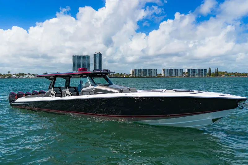  Yacht Photos Pics 2023 Nor-Tech 500 Sport Center Console boat on water, cityscape background.