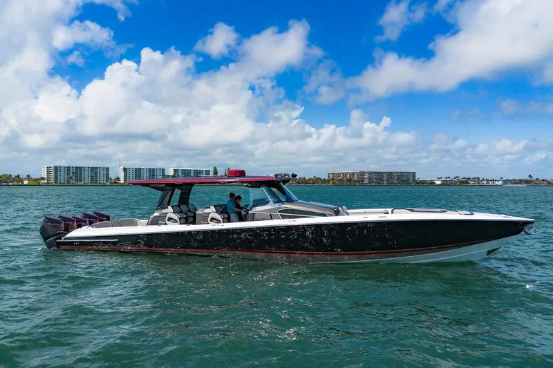  Yacht Photos Pics 2023 Nor-Tech 500 Sport Center Console boat cruising on open water under a blue sky.