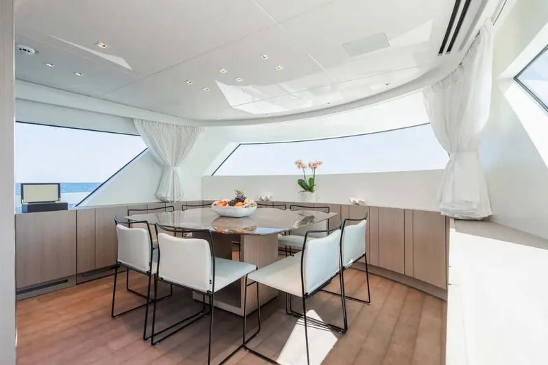 La Valletta Yacht Photos Pics Luxurious dining area on 2024 Sanlorenzo SX76 yacht with panoramic windows and elegant decor.