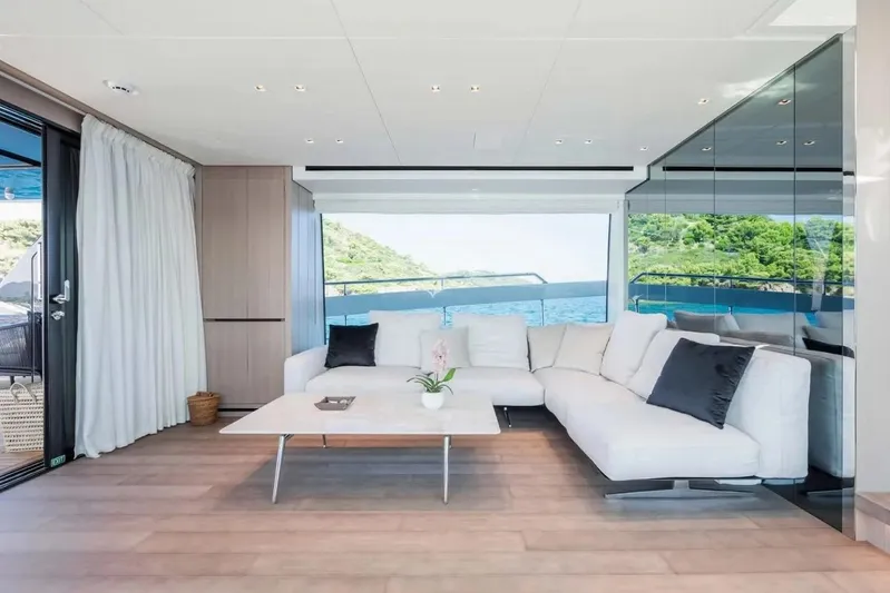 La Valletta Yacht Photos Pics Luxurious interior of 2024 Sanlorenzo SX76 yacht with modern white sofa and scenic ocean view.