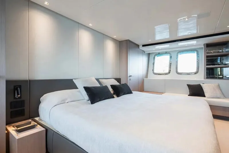 La Valletta Yacht Photos Pics Luxurious bedroom interior of 2024 Sanlorenzo SX76 yacht with modern design and large windows.