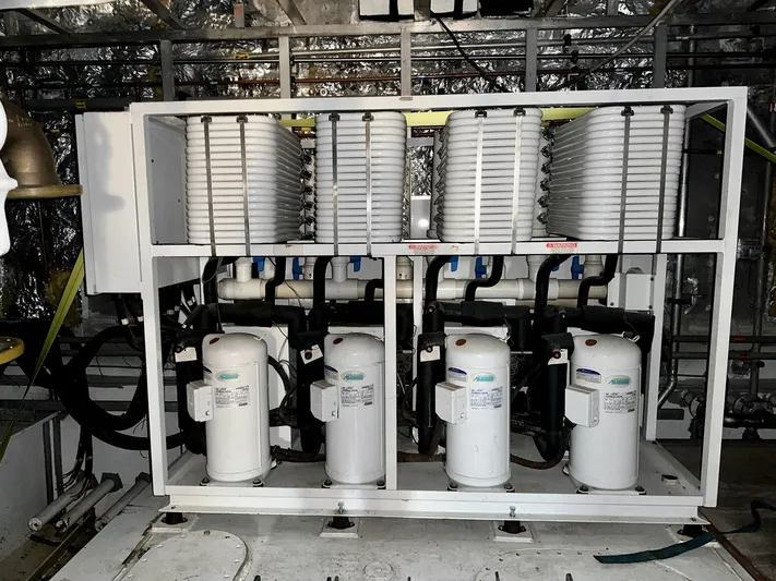  Yacht Photos Pics Engine room machinery of 2026 Trinity Yachts Custom T052, featuring advanced cooling systems.