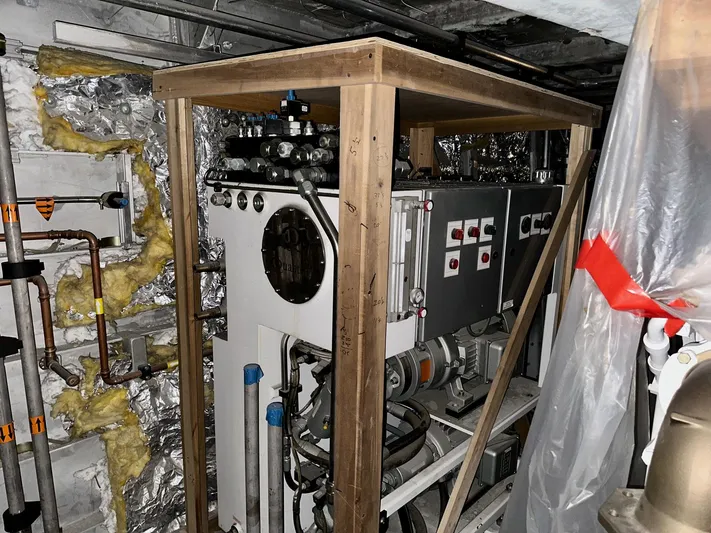  Yacht Photos Pics Engine room of 2026 Trinity Yachts Custom T052, featuring machinery and insulation.