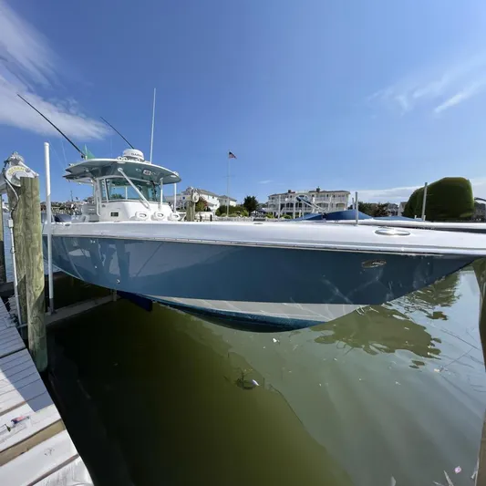 Pebbles Yacht Photos Pics 2008 Everglades 350 CC boat docked at marina, clear sky background.