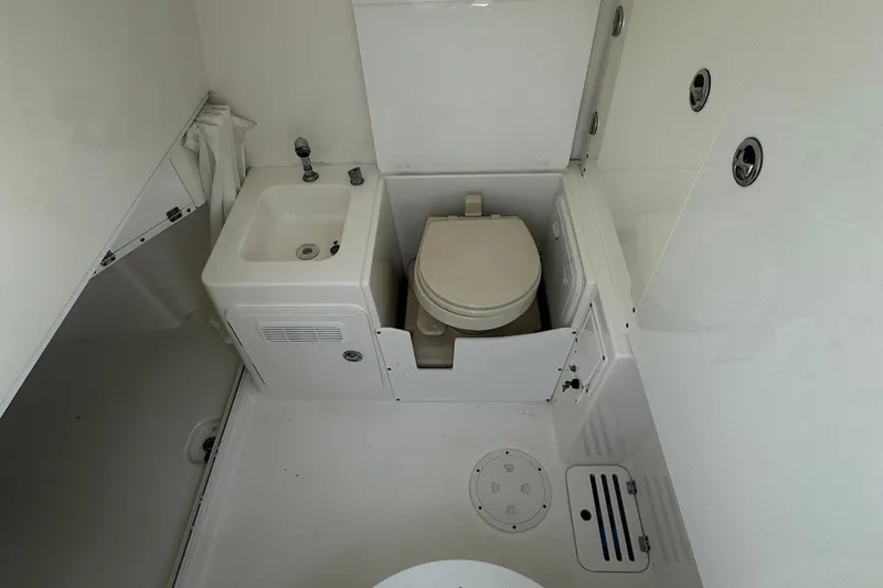 Pebbles Yacht Photos Pics 2008 Everglades 350 CC boat bathroom with sink and toilet.