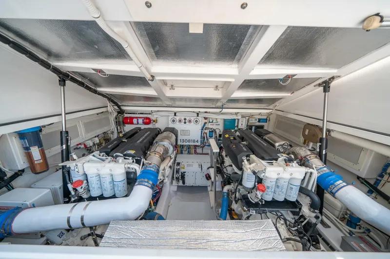 Big Hit Yacht Photos Pics Engine room of 2020 Cabo 40 Express boat, showcasing dual engines and equipment.