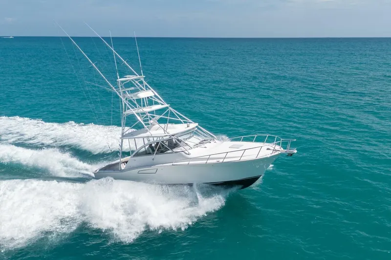 Big Hit Yacht Photos Pics 2020 Cabo 40 Express yacht cruising on open ocean waters.