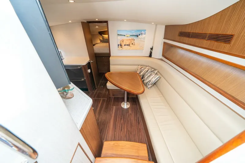 Big Hit Yacht Photos Pics Luxurious interior of 2020 Cabo 40 Express yacht with elegant seating and wooden accents.