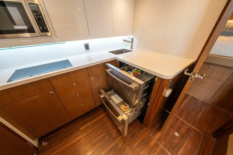 Big Hit Yacht Photos Pics Modern kitchen in 2020 Cabo 40 Express yacht with sleek cabinetry and appliances.