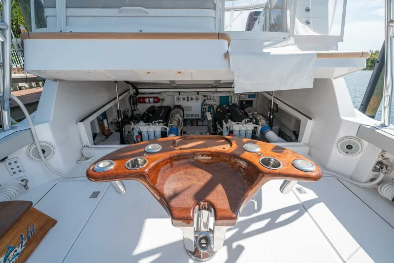 Big Hit Yacht Photos Pics Engine compartment of 2020 Cabo 40 Express yacht with wooden fishing station.